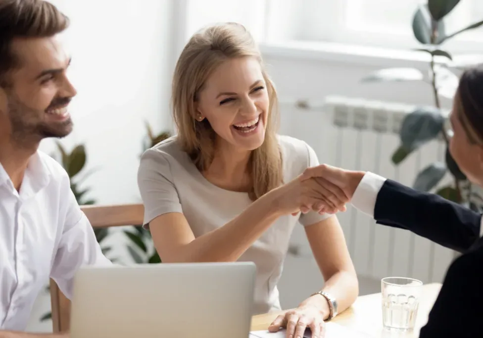 Excited,Laughing,Businesswoman,Shaking,Hand,Of,Business,Partner,At,Successful Excited,Laughing,Businesswoman,Shaking,Hand,Of,Business,Partner,At,Successful