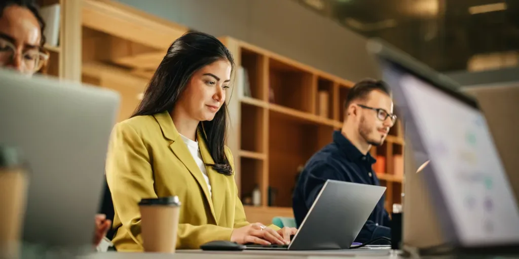 Group,Of,Diverse,Creative,Team,Members,Using,Laptops,In,An Group,Of,Diverse,Creative,Team,Members,Using,Laptops,In,An